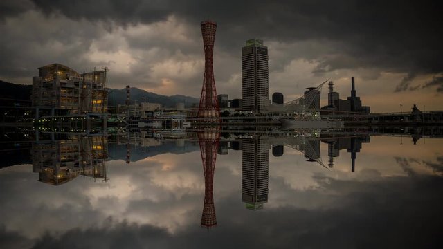 Kobe skyline time lapse at the port, stormy clouds with reflection