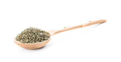 Wooden spoon with dried parsley on white background