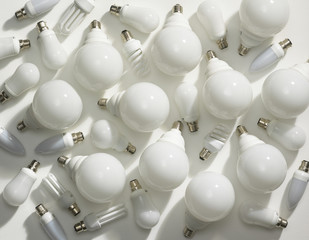 SELECTION OF ENERGY SAVING LIGHT BULBS ON WHITE BACKGROUND