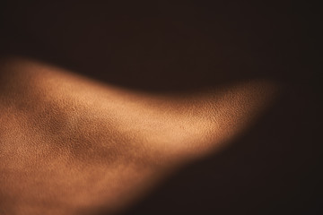  Leather surface on tangential sunlight for backgrounds and wallpapers