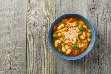 Minestrone soup with pasta and cheese.