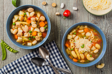 Minestrone soup with pasta and cheese or crostini.