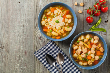 Minestrone soup with pasta and cheese or crostini.