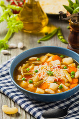 Minestrone soup with pasta and cheese.
