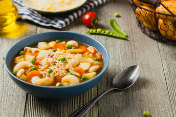 Minestrone soup with pasta and cheese.
