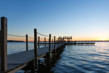 Fototapeta na wymiar Sunset on Beautiful Lake with Dock