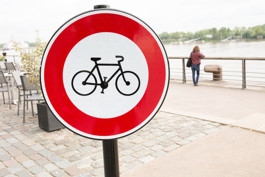 red and white signroad for cycle and bike forbidden near city river