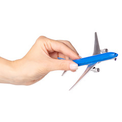 Miniature airplane in hand travel