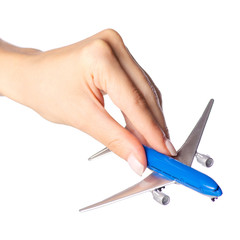 Miniature airplane in hand travel