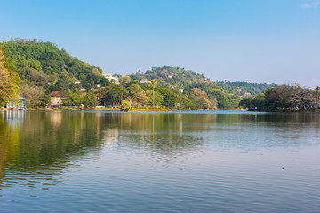 Fototapeta na wymiar The Kandy lake is an artificial body of water in the heart of the city Kandy with lot of legends and folklore regarding the lake
