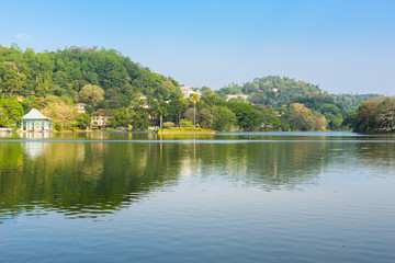 Fototapeta na wymiar The Kandy lake is an artificial body of water in the heart of the city Kandy with lot of legends and folklore regarding the lake