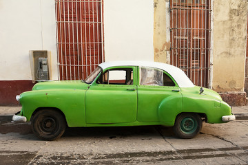Old American car parked on the Trinidad street