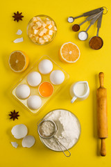 Obraz na płótnie Canvas Baking flat lay background with eggs floor butter lemon sieve