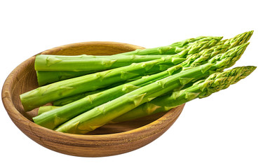 Fresh green shoots of asparagus in a wooden bow