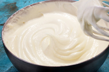 close up of a white whipped or sour cream in bowl.