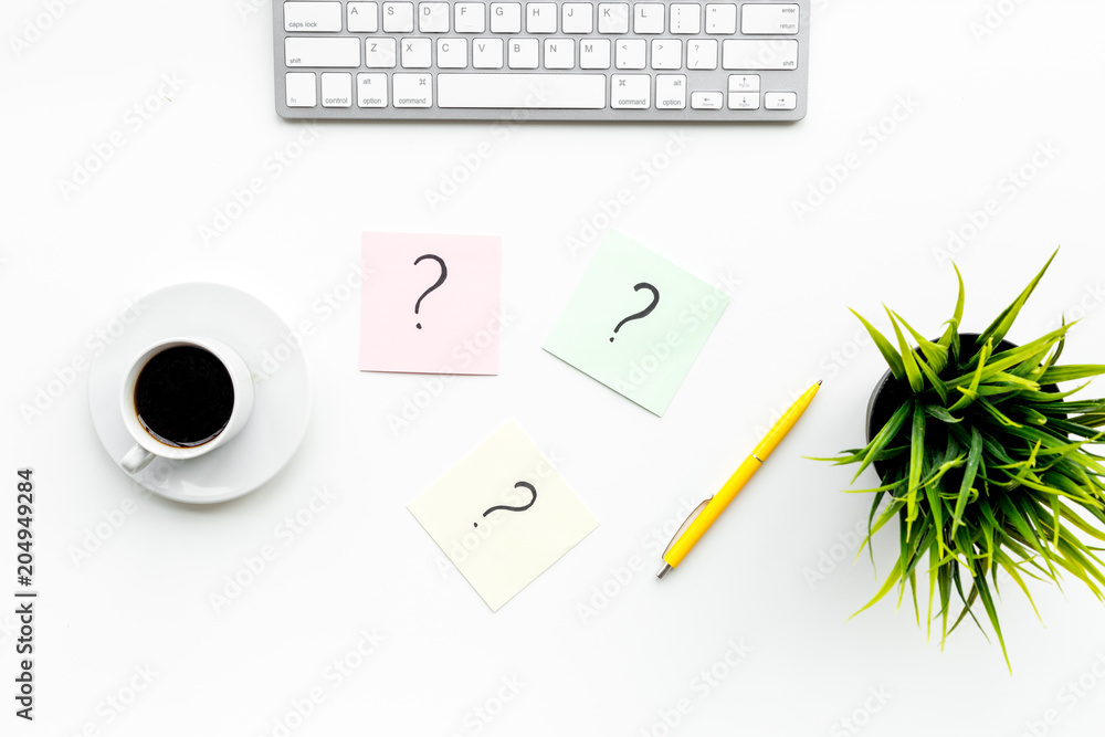 Poster question mark on sticky notes on office desk on white background top view. faq concept. working with