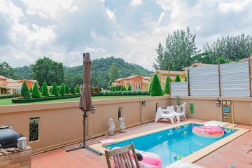 Orange home tuscany style in khaoyai resort at nakhonratchasima,vivid,sunny day,beautiful sky