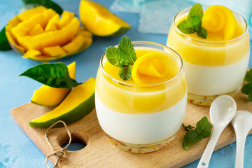 Mango Panna cotta with mango jelly and mint, Italian dessert, homemade cuisine.