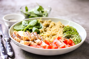 Healthy salad bowl with quinoa and chicken