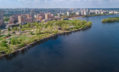 Fototapeta na wymiar Aerial view of new modern residential Obolon district near Dnieper river in Kiev city, Kyiv cityscape from above, Ukraine 