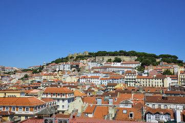 Beautiful view of the city of Lisbon, with the skyline and the Sao Jorge Castle; Concept for travel in Lisbon