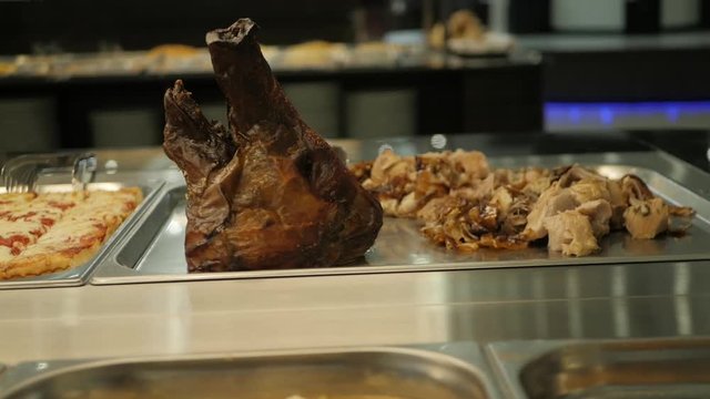 Pan right, pig head on dish