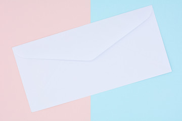 white envelope mail on pink and blue background