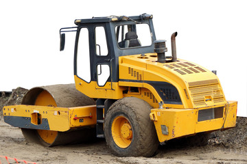 Yellow wheel roller. Yellow road rammer.