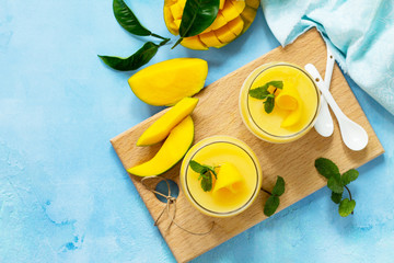 Homemade dessert panna cotta with mango jelly. Copy space, top view flat lay background....