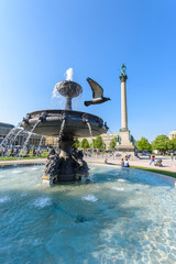 Fototapeta na wymiar Schlossplatz (Castle square) with Fountains in Stuttgart City, Germany