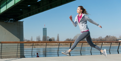 Women running on bridge