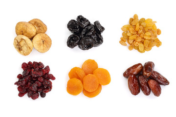 Set of dried fruits isolated on white background. Top view. Flat lay