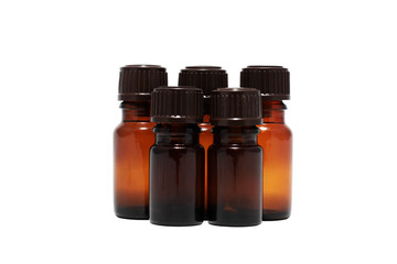 five bottles of aromatherapy oils isolated