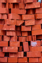 Heap of red bricks. Background red brick texture