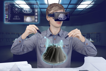 Virtual reality in engineering concept. Male / man wearing shirt and vr glasses holding...