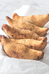 Cherry empanadas on the white baking paper