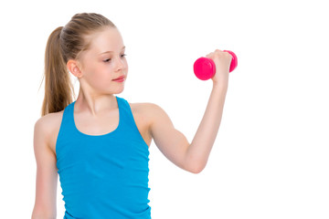 A little girl shows her muscles.