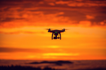 Fototapeta na wymiar Flying drone above the clouds.