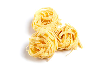 Tagliatelle italian pasta isolated on white background