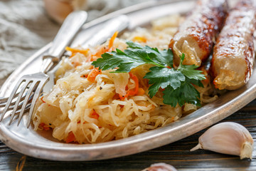 Braised sauerkraut, sausage and green parsley.
