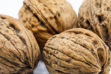 Close up view of some walnuts with white background