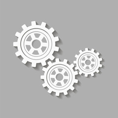 Mechanical gears with a shadow. Vector icon