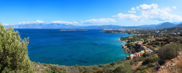 Panoramic high point view at sunset of the picturesque gulf of Mirambello, with the island of Agioi...