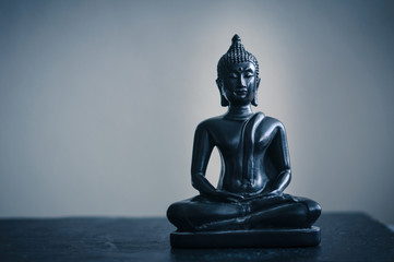 Fototapeta na wymiar black statue of Buddha