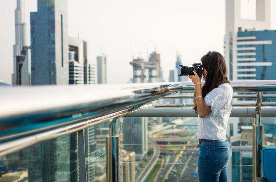 Photographer taking picture of Dubai cityscape