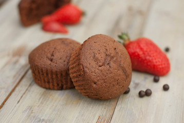 Chocolate Muffins with Strawberry Mint Leaves over rustic Gray Background Breakfast desert