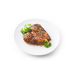 Grilled Chicken Breast with peppercorn parsley and seasame seeds isolated on white