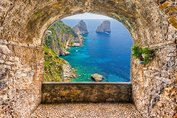Rock balcony overlooking the Faraglioni rocks, island of Capri, Italy