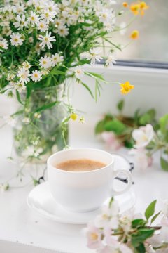 cup of morning coffee with flowers