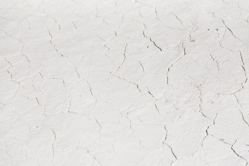 White cracked background texture, light background with dark scratch, the ground near the chalk quarry, copy space